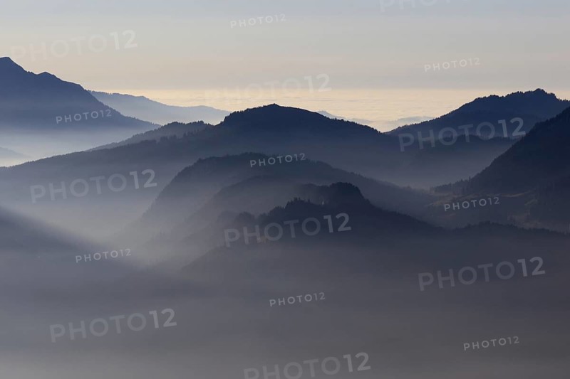 Mountain silhouettes... Alpine peaks and mountain ranges in the Bavarian Alps, light fog rises from the valleys, which creates an idyllic atmosphere in the light of the low sun, romantic view from Oberstdorf towards Kleinwalsertal, local nature, Bavaria, AllgÃ¤u, AllgÃ¤u Alps, Bavarian, Germany, Western Europe