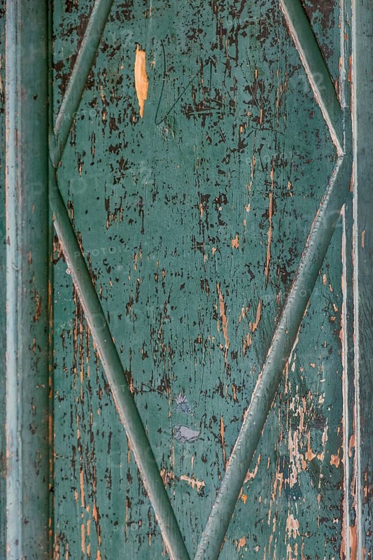 Old wooden door with peeling paint, texture, background, Germany