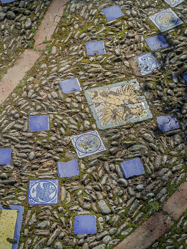 Street paving made of pebbles and tiles background, texture, Andalusia, Spain