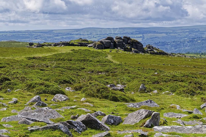 Stones and landscape at the top Tor tor rock hill in Dartmoor National Park. Widecombe-in-the-Moor, Bovey Tracey, Devon, South England, Great Britain