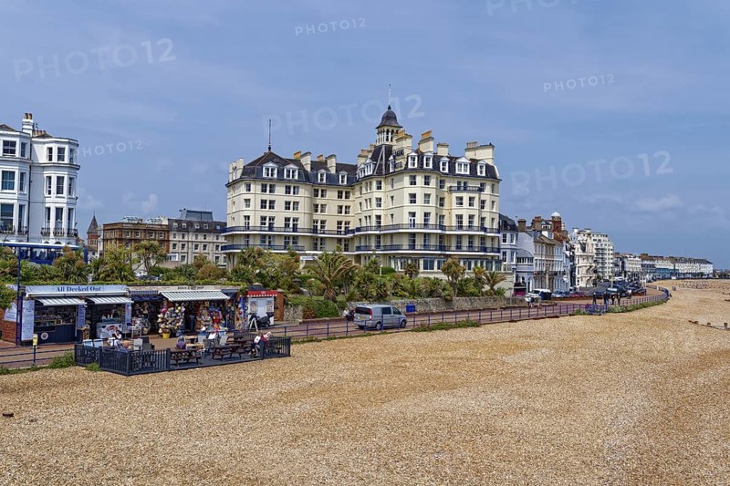 Beach and building on the seafront in Eastbourne, seaside resort on the English Channel, in the county of East Sussex, England, United Kingdom of Great Britain