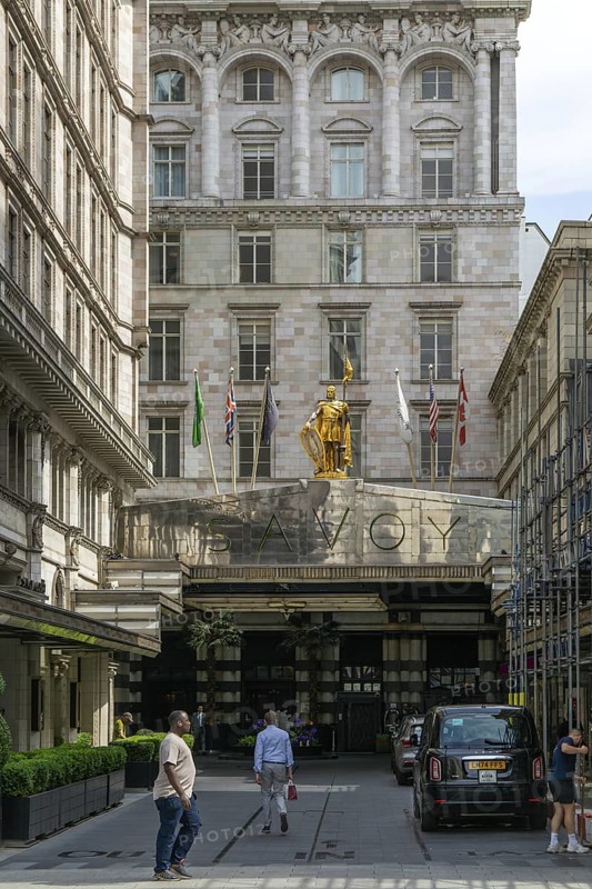 Count Peter of Savoy golden figure above entrance to The Savoy hotel, Strand, central London, England, UK