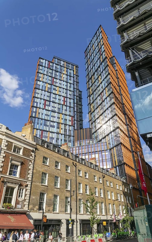 Tower block apartments of One Crown Place rise high above older properties, Sun Street, City of London, England, UK
