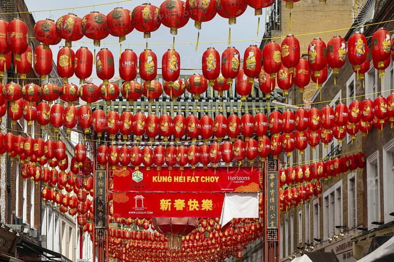 Red Chinese lanterns crossing above Gerrard Street, Chinatown, West End, London, England, UK