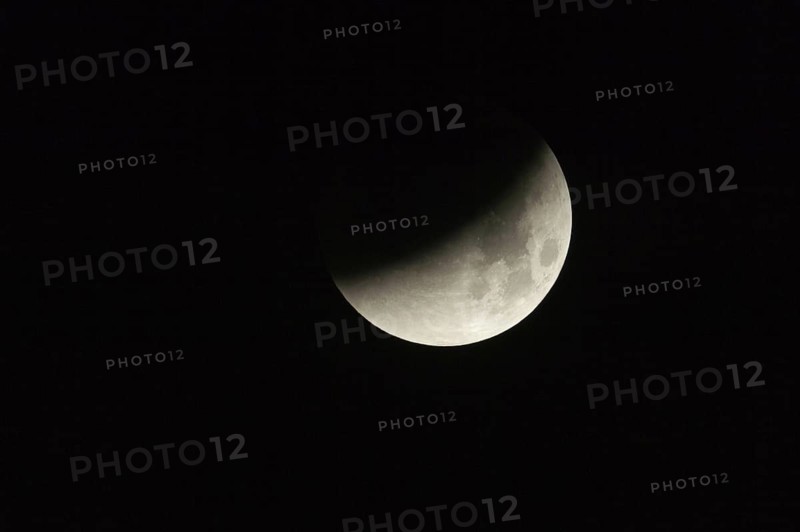 On 28.09.2015, 03:41 am... partial lunar eclipse, full moon dips into the earth's shadow, appears as a crescent moon lying on its back, night-black sky, dark night, super telephoto, super moon, local nature, Meerbusch, DÃ¼sseldorf, Rhineland, Lower Rhine, North Rhine-Westphalia, Germany, Western Europe