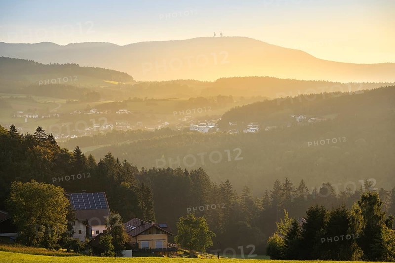 View from the Rossberg to the Hohenbogen (High Arch), landscape with forest, meadows and mountains around the town of Bad Kötzting. In the morning at sunrise. District of Cham, Upper Palatinate, Bavarian Forest, Bavaria, Germany