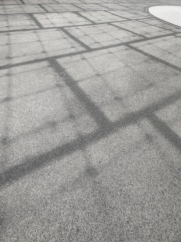 Roof construction casts shadows on the ground, Olympic Park, Munich, Bavaria, Germany