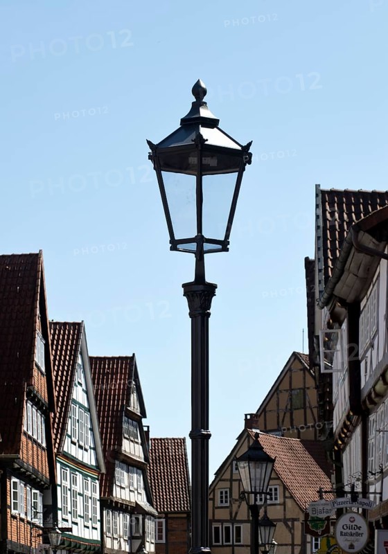 Street with half-timbered houses and historic street lamp in the old town centre, Celle, Lower Saxony, Germany