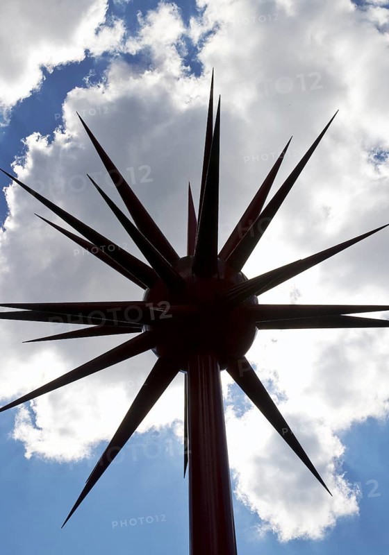 Work of art by Otto Piene entitled Fireworks for Celle as a silhouette against the light in front of clouds, Lower Saxony, Germany