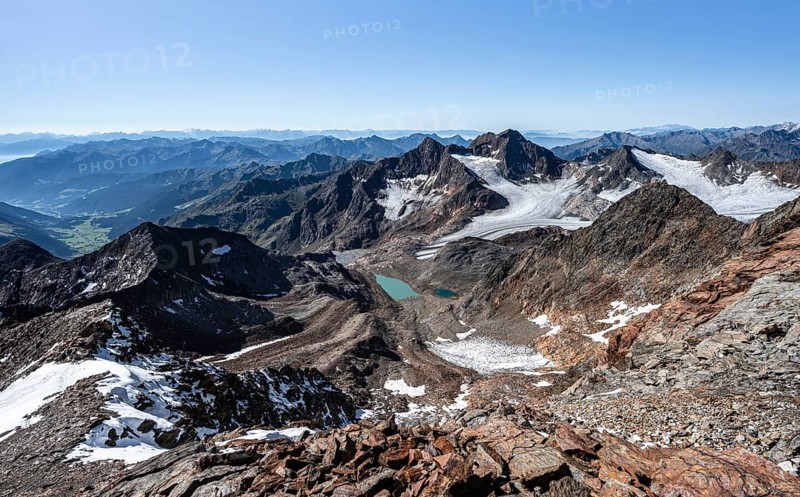 View of mountain basin with blue glacier lakes, Ãœbeltalferner glacier and Königshofspitz summit in the background, view with mountain panorama into the Ridnaun valley, descent from the Wilder Freiger summit, Stubai Alps, South Tyrol, Italy