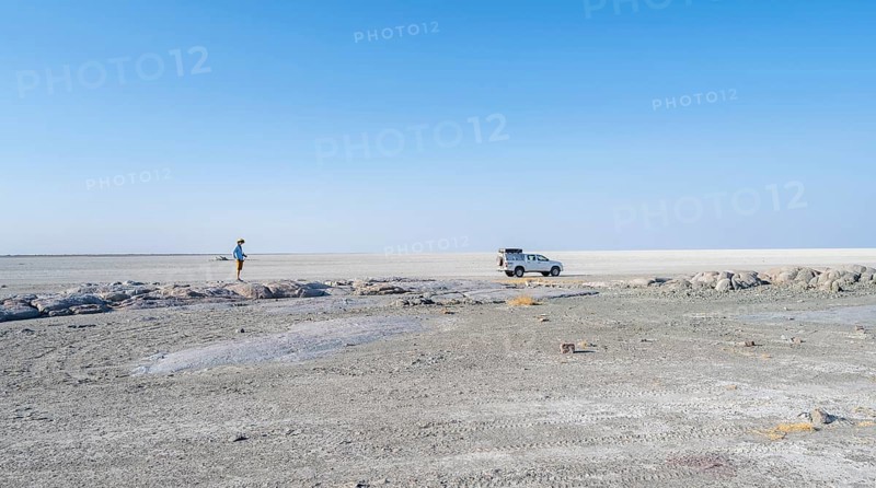 Vast white empty landscape on a salt pan, tourist and off-road vehicle, Kubu Island (Lekubu), Sowa Pan, Makgadikgadi salt pans, Botswana