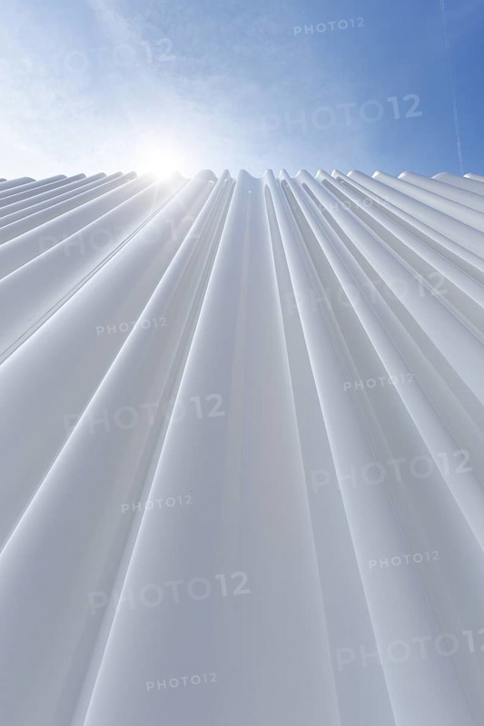 Modern white faÃ§ade made of corrugated acrylic glass, Plexiglas, SANAA production hall, architect Kazuyo Sejima and Ryue Nishizawa, sun rays, Vitra Campus, Vitra Design Museum, Weil am Rhein, Baden-WÃ¼rttemberg, Germany
