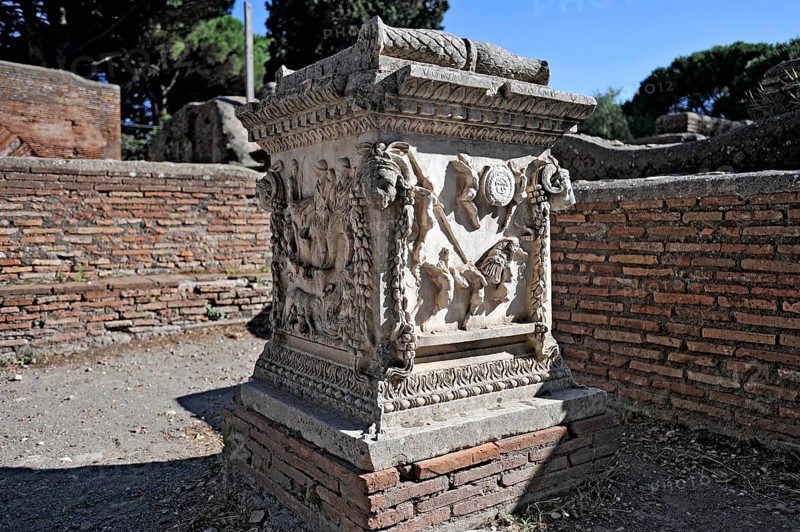 Relief on the sacred altar of Romulus and Remus, Sacello dell' Ara di Romolo e Remo, angel, chariot, stone carving, remains, ruins, ancient port city of Rome, excavation site Archaeological Park Ostia Antica, metropolitan city of Rome, Lazio, Italy