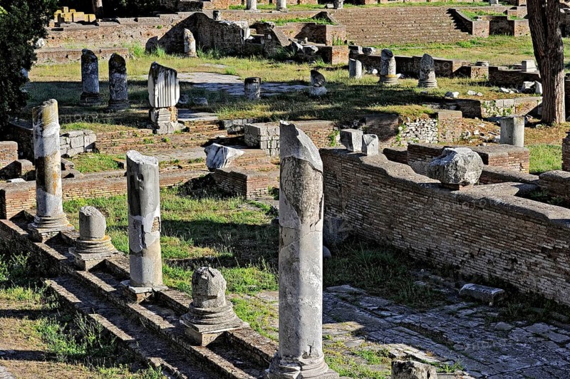 Remains of columns, foundation walls, streets, ruins of the forum in the archaeological site of Ostia Antica Archaeological Park, Metropolitan City of Rome, Lazio, Italy
