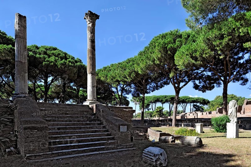 Ruins of the Tempio di Cerere, temple of the goddess Ceres, remains, podium temple with staircase and columns, Piazzale delle Corporazioni, ancient port city of Rome, excavation site Archaeological Park Ostia Antica, metropolitan city of Rome, Lazio, Italy