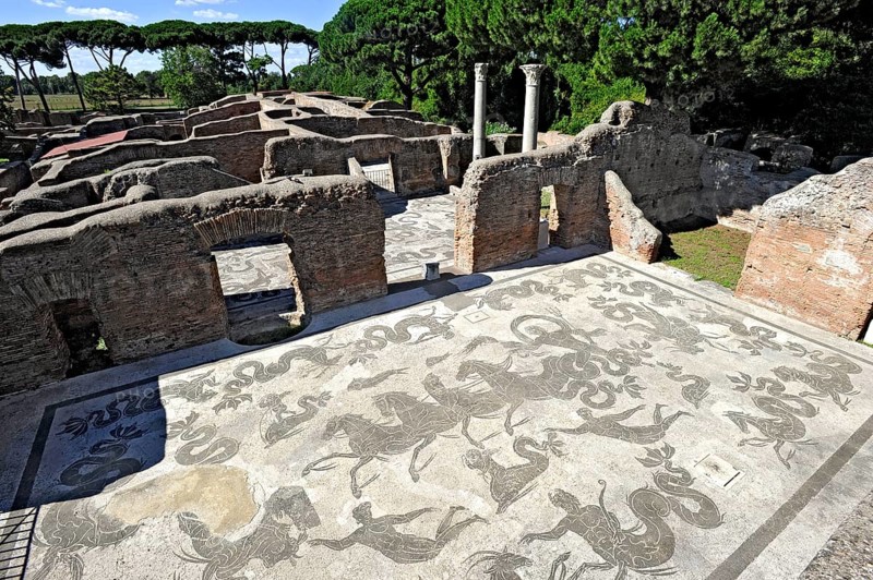Ruins with mosaics on the floor of the Terme di Nettuno, thermal baths of the sea god Neptune, Roman bathhouse, ancient port city of Rome, excavation site Archaeological Park Ostia Antica, metropolitan city of Rome, Lazio, Italy