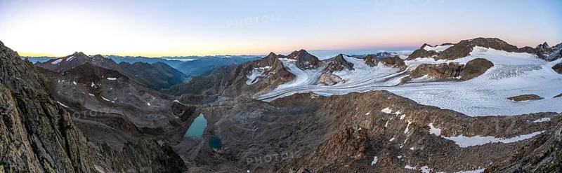 Panorama at sunrise, high mountain landscape, view of blue glacial lakes, mountain peaks Königshofspitz and Hofmannspitze with glacier of the Ãœbeltalferner, Stubai Alps, South Tyrol, Italy