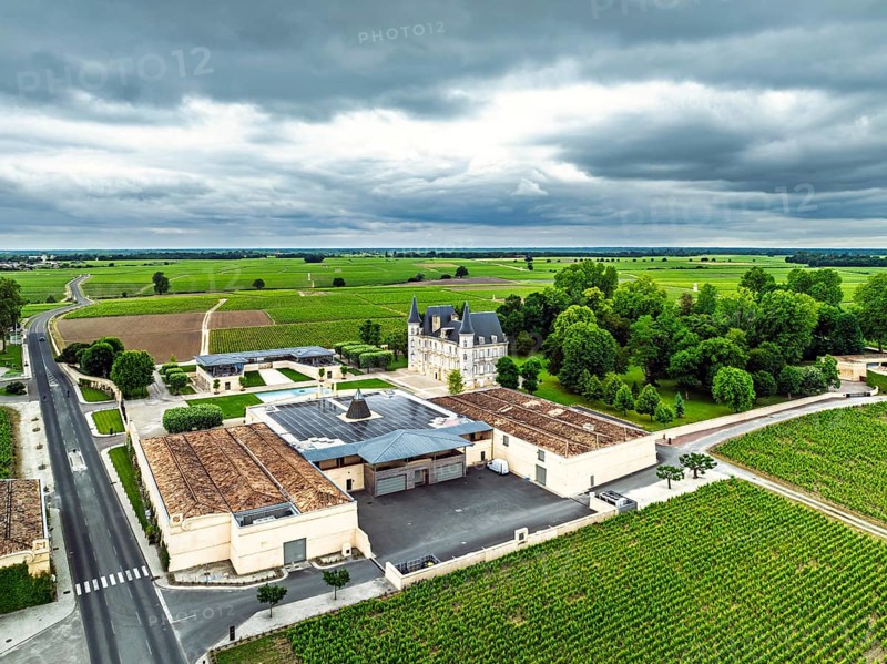 Chateau Pichon Longueville Baron Vineyard and grape fields around Pauillac from a drone, Bordeaux, Gironde, Nouvelle-Aquitaine, France