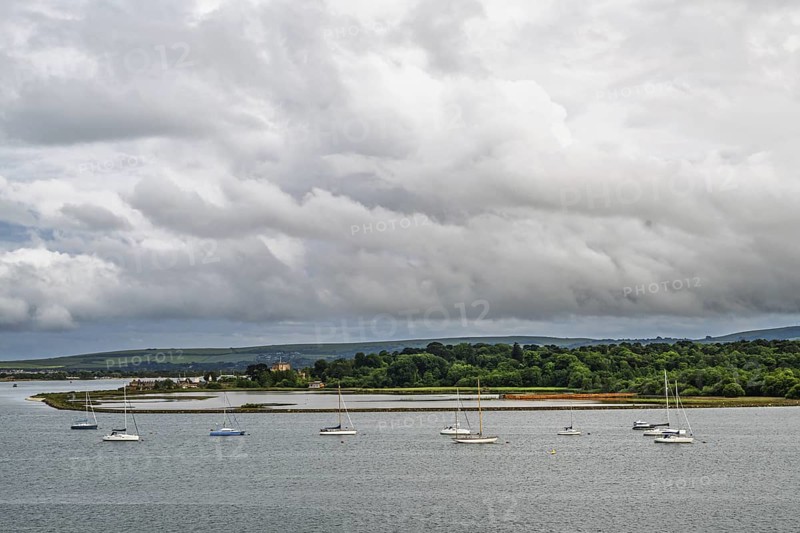 Yachts over Ramshorn Lake and Brownsea, Poole, Dorset, England, United Kingdom