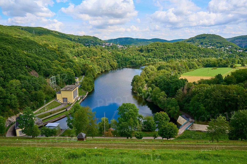 Quiet river dam surrounded by green hills and forests under a cloudy sky, summer, Rursee, Rurtalsperre, Heimbach, Simmerath, Eifel National Park, North Rhine-Westphalia, Germany