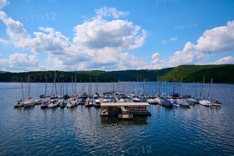 Sailing boats at a jetty, with partly cloudy sky, summer, Rursee, Rurtalsperre, Heimbach, Simmerath, Eifel National Park, North Rhine-Westphalia, Germany