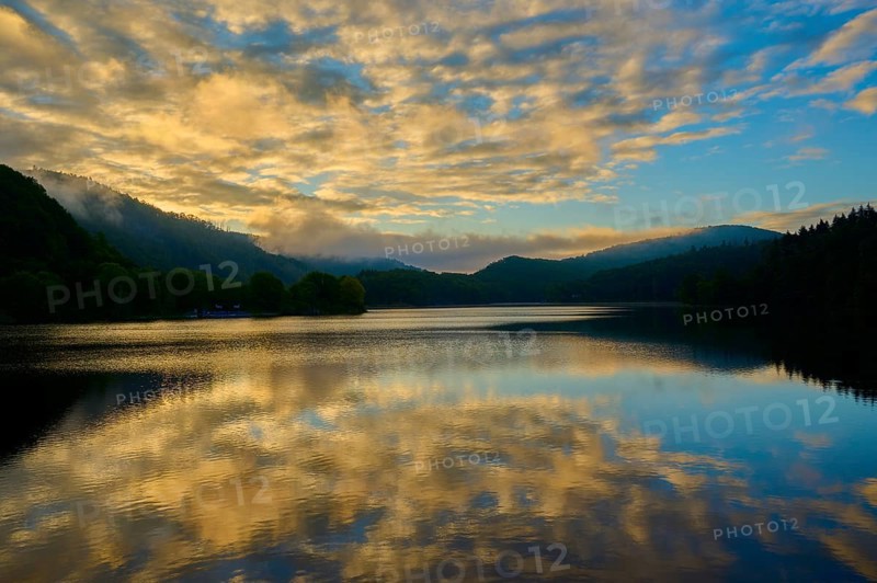 Reflection of clouds on a calm lake at dusk, summer, Rursee, Obersee, Rurberg, Simmerath, Eifel National Park, North Rhine-Westphalia, Germany