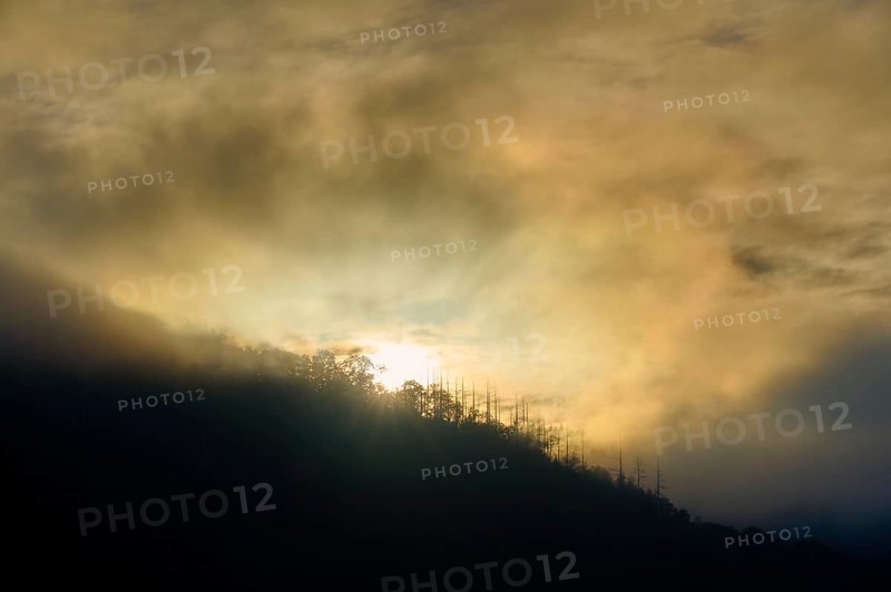 Sunset behind mountains, surrounded by fog and clouds, summer, Rursee, Obersee, Rurberg, Simmerath, Eifel National Park, North Rhine-Westphalia, Germany