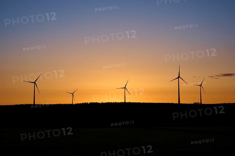 Wind turbines in front of an orange-coloured sunrise, Rohren, Monschau, Eifel, North Rhine-Westphalia, Germany