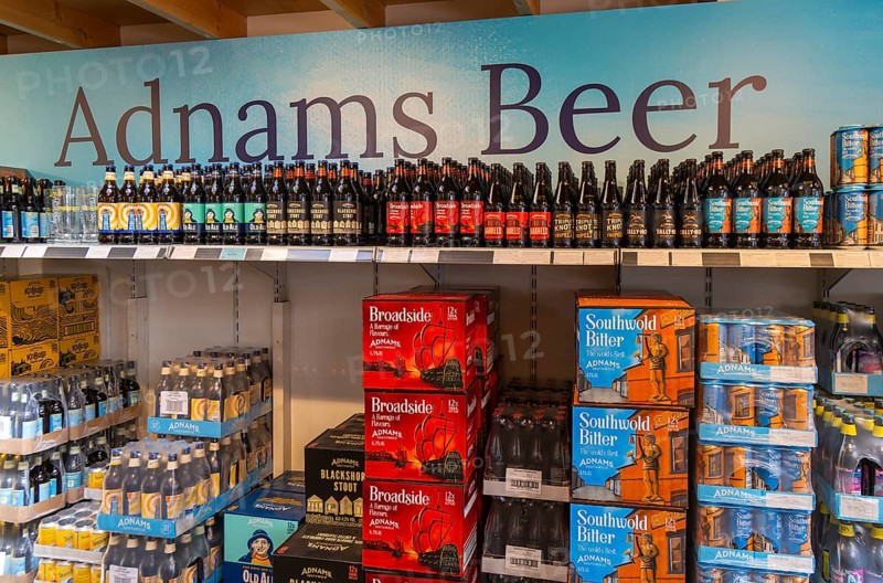 Adnams beer products on display inside brewery shop, Southwold, Suffolk, England, UK