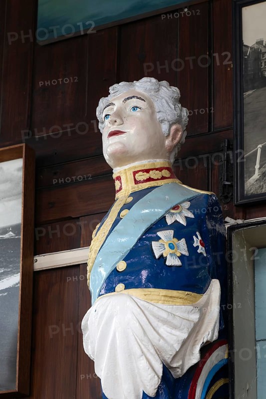 Interior of historic The Sailors Reading Room, Southwold, Suffolk, England, UK - figurehead of King William IV known as Sailor Bill