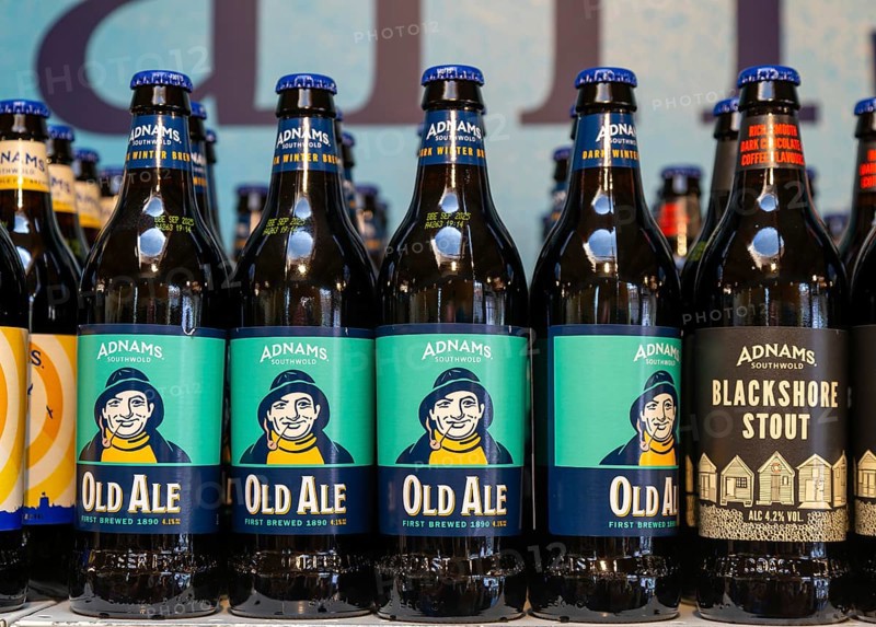 Adnams beer products on display inside brewery shop, Southwold, Suffolk, England, UK - Old Ale bottles