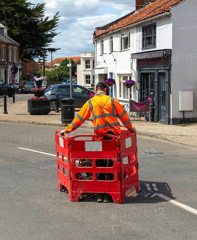 British Telecom technicians working on fibre optic Broadband in street, Southwold, Suffolk, England, UK