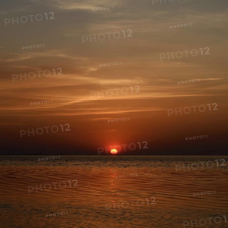 Fireball... Sunset over the Wadden Sea near Duhnen, Cuxhaven, North Sea, glowing red setting sun, sun sinks into the sea, a beautiful day comes to an end, North Sea coast, atmospheric picture, local nature, Lower Saxon Wadden Sea National Park, North Sea near Cuxhaven, Duhnen, Lower Saxony, Germany, Western Europe