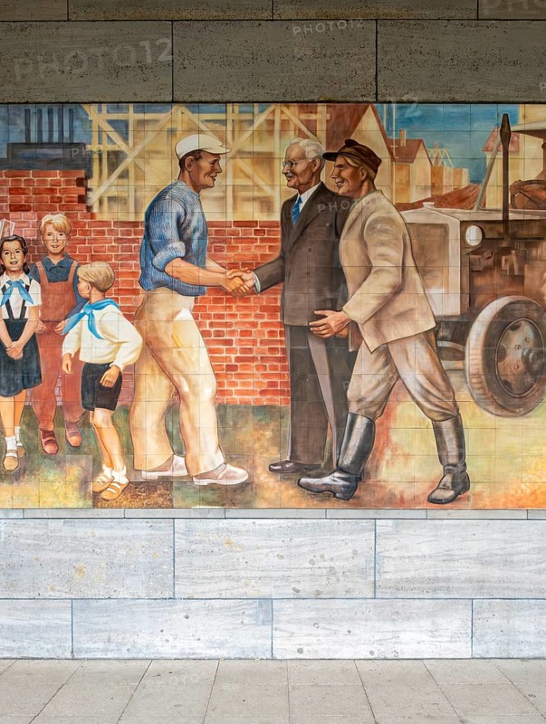 Close-up of the GDR-era Max Lingner propaganda mural, Detlev Rohwedder House, Berlin, Germany