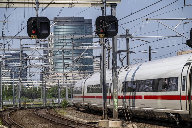 Rail traffic in the Netherlands, ICE 3neo of Deutsche Bundesbahn on the way to Amsterdam Centraal, on the tracks in front of Utrecht Centraal station, Netherlands
