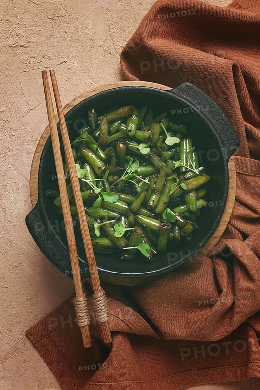 Fried bean pods, in soy sauce, with sesame seeds, homemade, no people