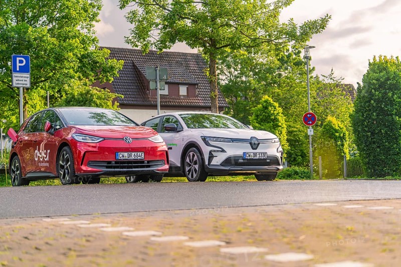 Two electric cars parked under trees in a quiet residential street, Deer E, car sharing, electric car, Calw, Black Forest