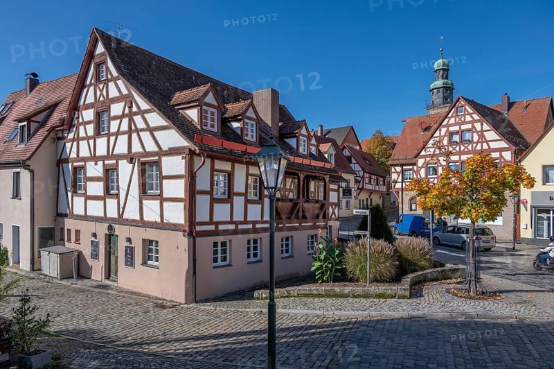 Historic half-timbered houses in the old town, tower of St. John's Church in the back, Lauf an der Pegnitz, Middle Franconia, Bavaria, Germany