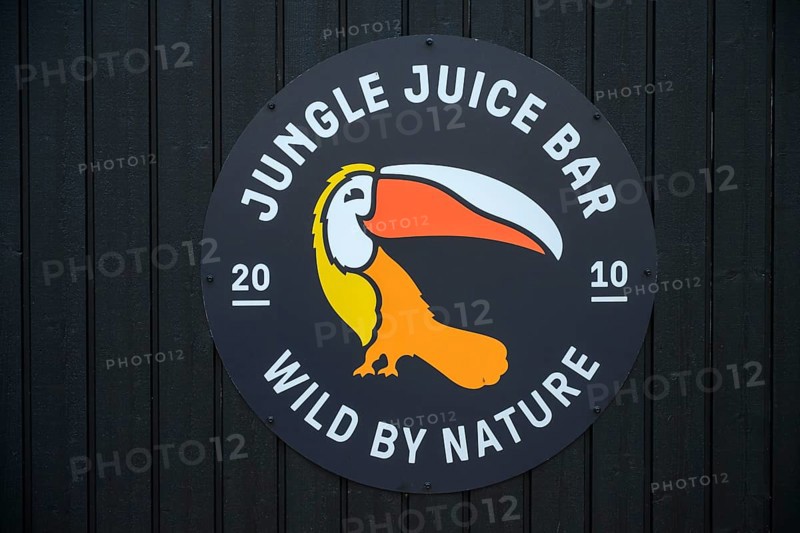 Street scene in the old town of Naantali, A jungle juice bar tropical logo with a toucan on a dark wooden background, Naanatali, Varsinais-Suomi, Finland