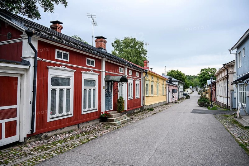 Street scene in the old town of Naantali, colorful traditional buildings on a paved, quiet street, village atmosphere, Naanatali, Varsinais-Suomi, Finland