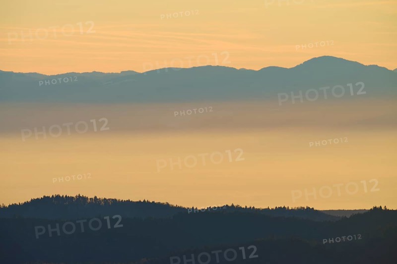 Morning haze over mountain hills in soft colors, looking towards the Rhine Valley, Hohneck, La Bresse, Vosges, France