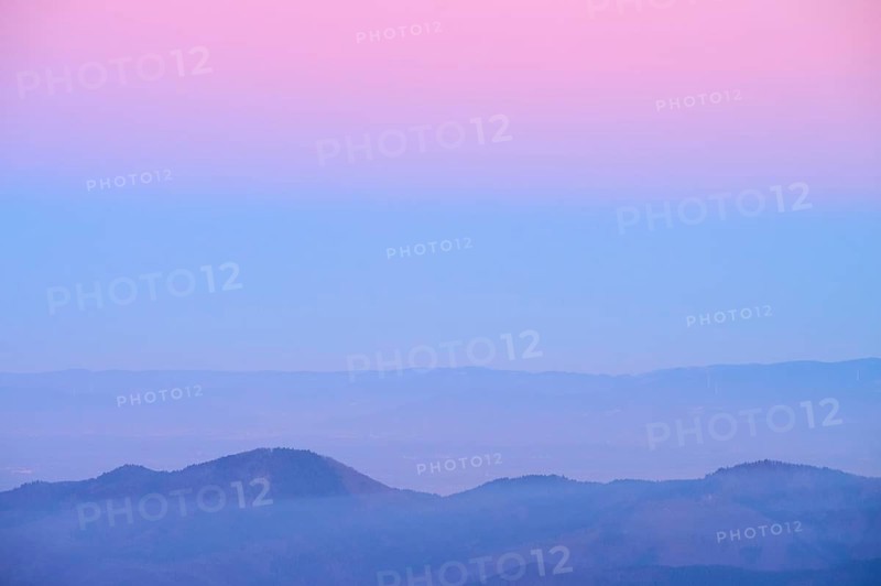 Mountain landscape with pastel-coloured sky at dusk, looking towards the Rhine Valley, Hohneck, La Bresse, Vosges, France