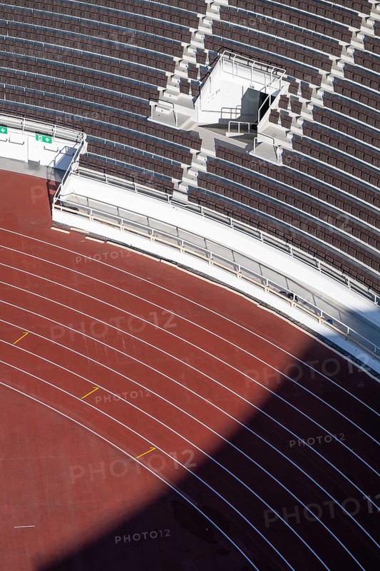 Modern stadium stand with empty seats, outdoor stairs and tartan track, Helsinki Olympic Stadium, architects Yrjö Lindegren and Toivo Jäntti, Helsinki, Finland