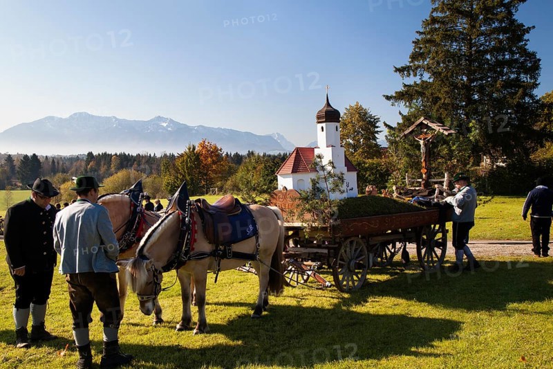 Name day move from St. Johannisrain to Penzberg on 23.10.2011 Horse wagon, church model, men in traditional costume, Upper Bavaria, Germany