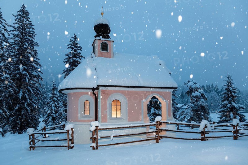 Maria-Königin chapel on Lautersee during snowfall, Werdenfelser Land, Upper Bavaria, Germany