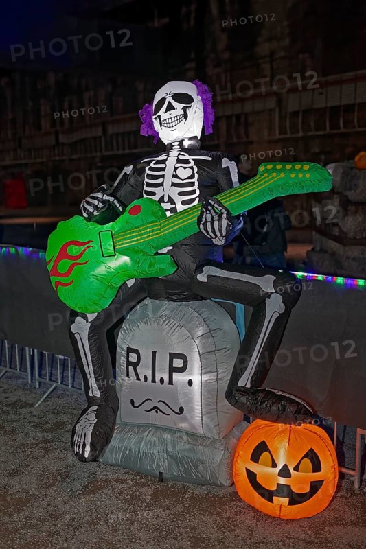 Death plays guitar, illuminated scary figure at Halloween Run, Landschaftspark Duisburg-Nord, Duisburg, Germany, North Rhine-Westphalia, Germany