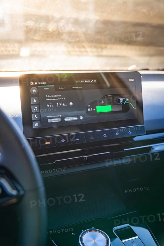 Modern car display with charging information and user interface in sunlight, MG4 electric car, Deer e-Carsharing, Calw, Germany