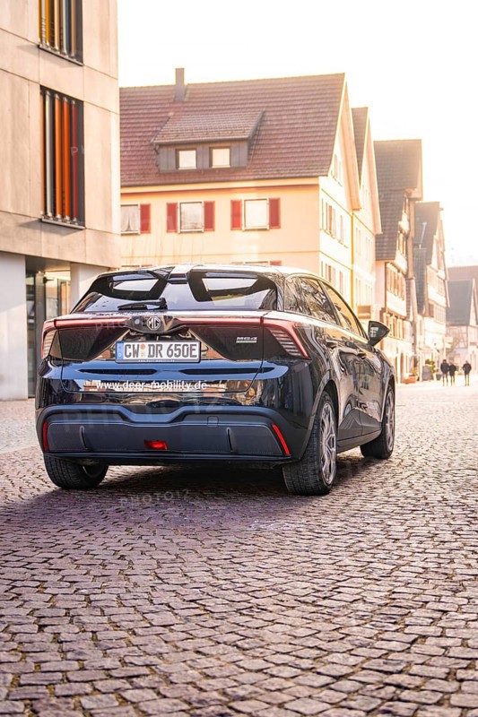 A modern car is parked on a cobblestone street in an old town at sunset, MG4 electric car, deer e-car sharing, Calw, Germany