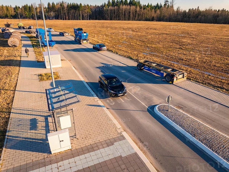 Several vehicles in a parking lot on a country road on a sunny autumn day, MG4 electric car, Deer e-Carsharing, Calw, Germany