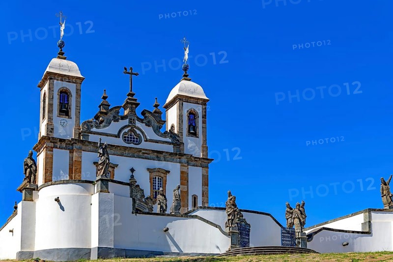 Historic baroque church facade in the Bom Jesus do Matosinhos sanctuary with the twelve prophets by Aleijadinho in the city of Congonhas, Congonhas, Minas Gerais, Brazil